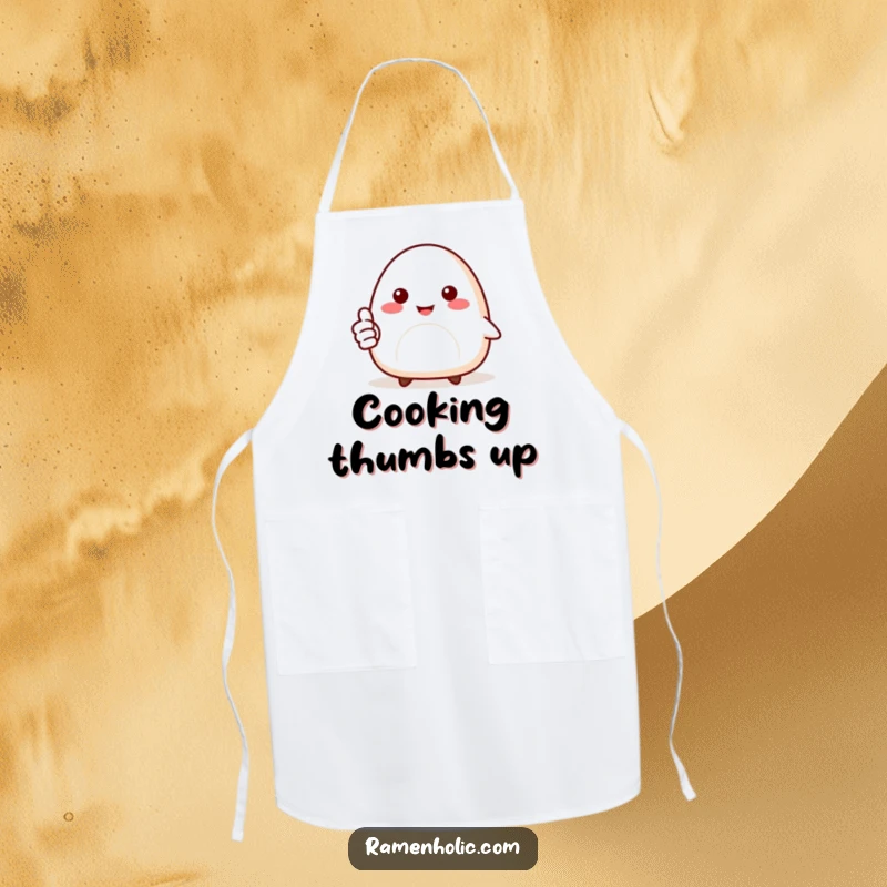 Funny kitchen apron featuring a smiling onigiri character giving a thumbs up, perfect for positive meal preparation.